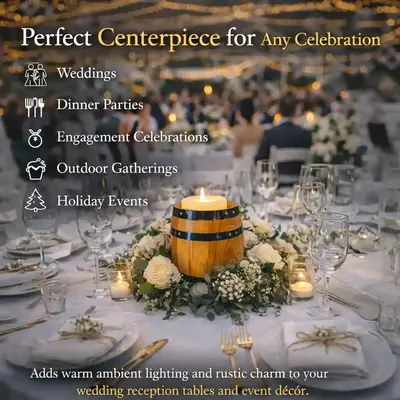 Rustic barrel candle holder centerpiece surrounded by flowers and candles on wedding reception table with string lights.